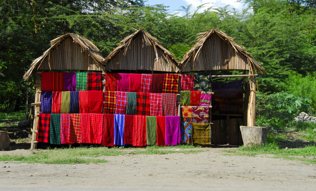 Shop-with-traditional-multicolored-Masai-blankets-along-the-road,Tanzania-000002831657_Large