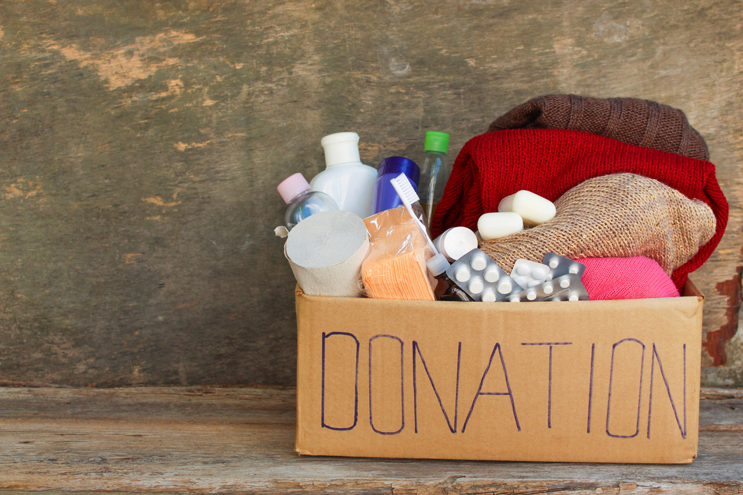 Donation box with clothes, living essentials