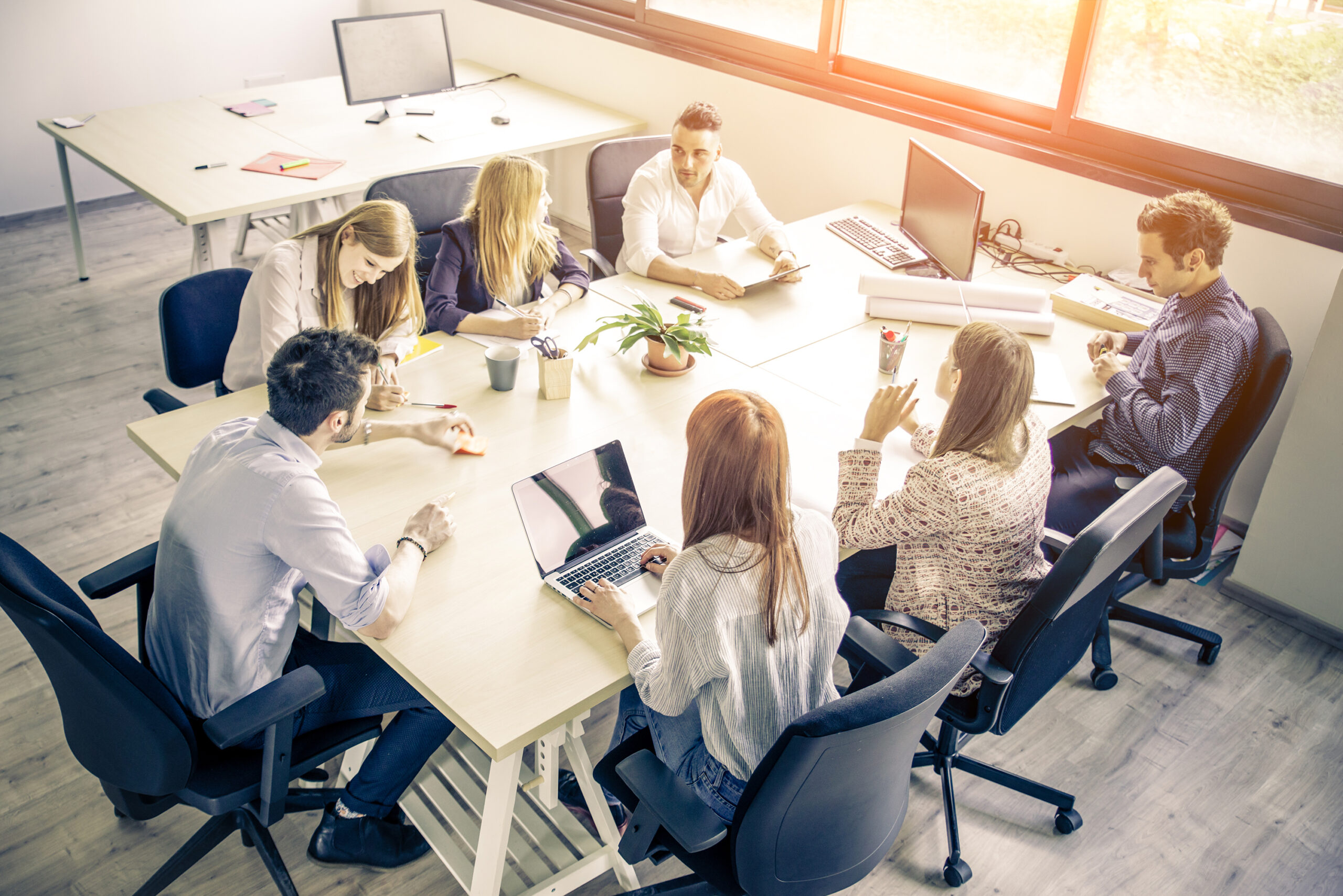 Meeting of young business people in a modern office - Start up company, workers brainstorming