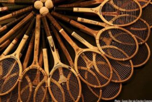 Antique tennis rackets forming an arc